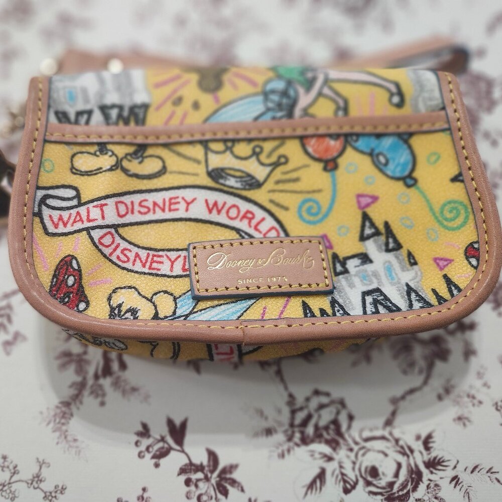 Disney Dooney and Bourke Mickey Dumbo Castle Yellow Flap Wristlet - Picture 2 of 2